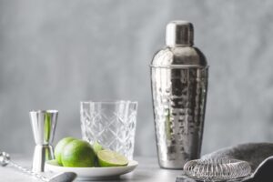 Cocktail shaker, strainer, bar spoon, glassware