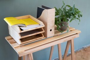 Paper and document wooden tray holders and organisers on desk, natural decor concept.